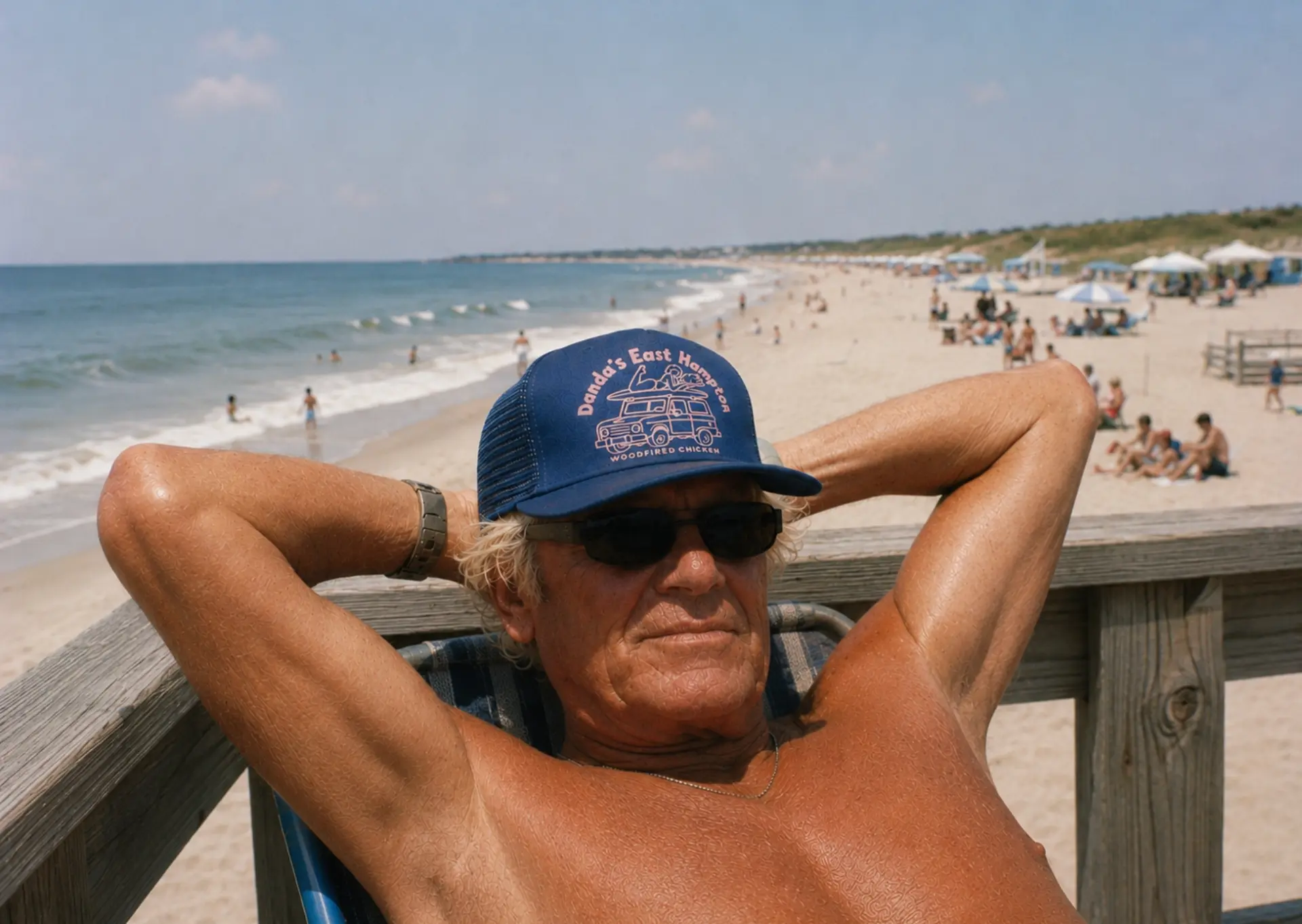 Regular in a Danda's East Hampton trucker hat on the beach