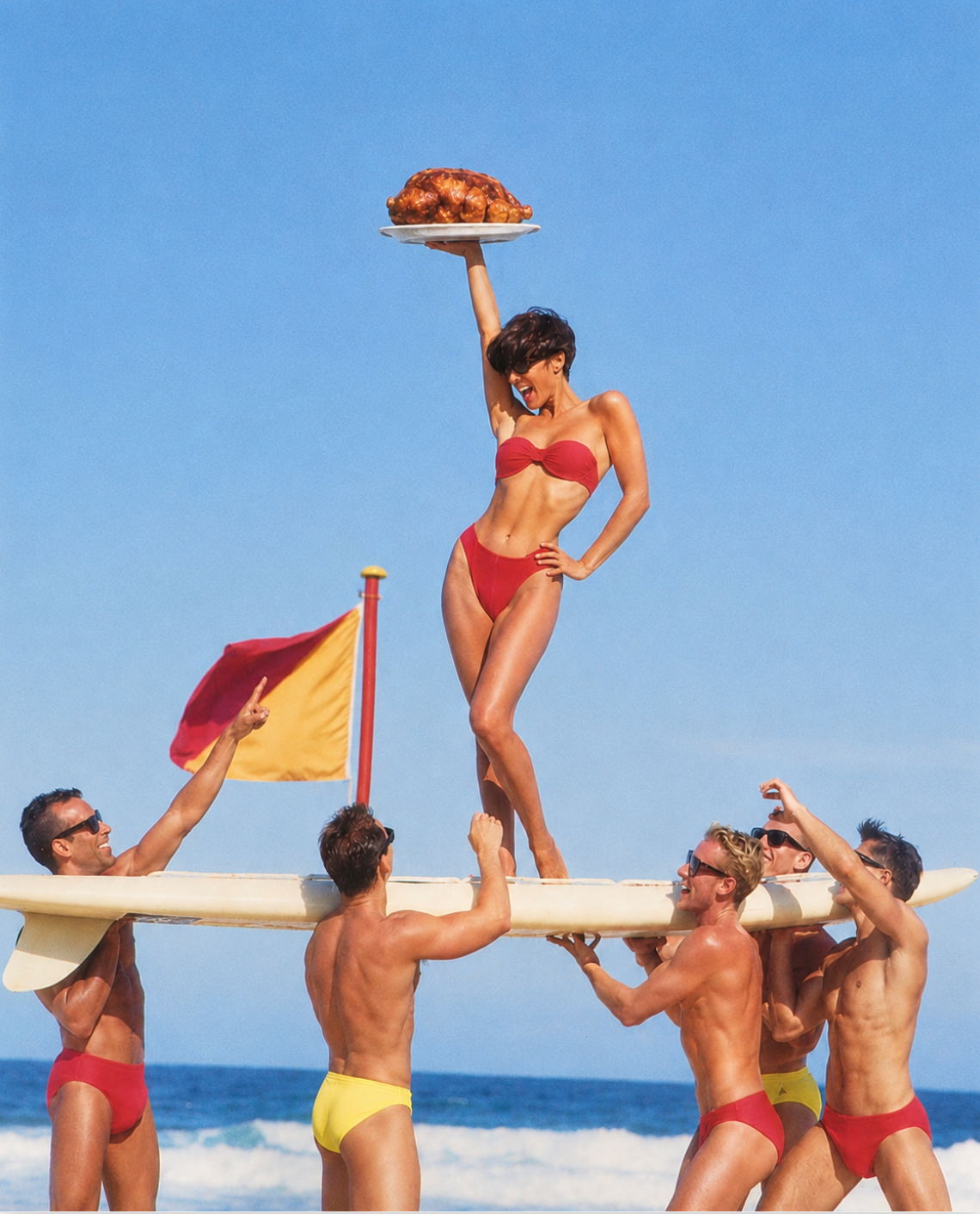 Beachgoers lifting a surfboard with a roast chicken platter